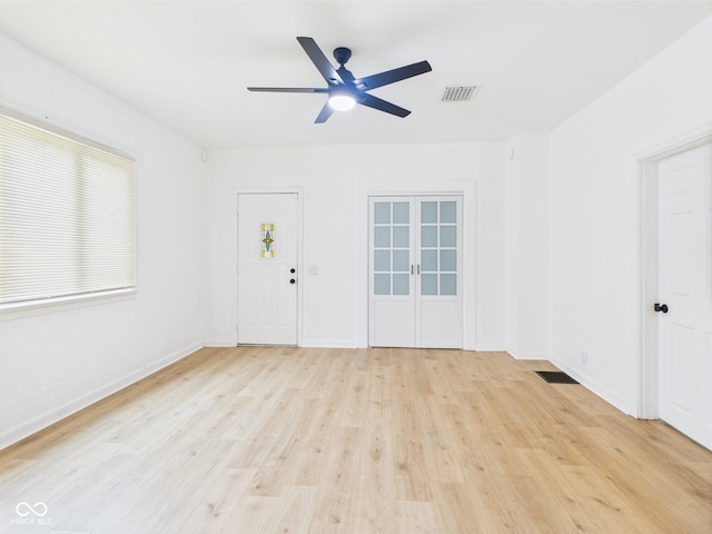 201 N 11th St, Elwood, IN 46036 - empty room with light wood-style floors, ceiling fan, and baseboards