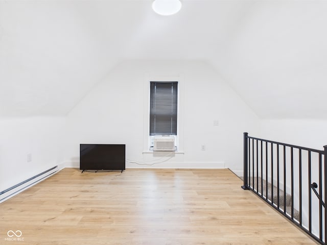 201 N 11th St, Elwood, IN 46036 - additional living space featuring light wood-type flooring, lofted ceiling, baseboard heating, baseboards, and cooling unit