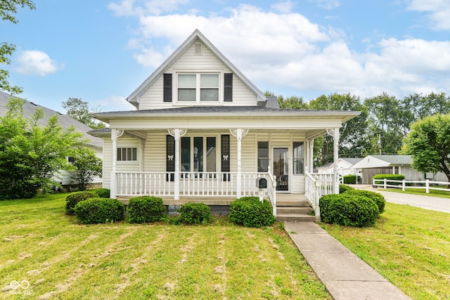 201 N 11th St, Elwood, IN 46036 - view of front facade featuring covered porch and a front yard