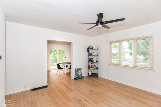 201 N 11th St, Elwood, IN 46036 - spare room featuring healthy amount of natural light, light wood-style flooring, and ceiling fan