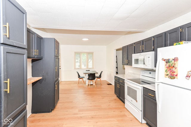 201 N 11th St, Elwood, IN 46036 - kitchen with white appliances, light countertops, light wood-style floors, and recessed lighting