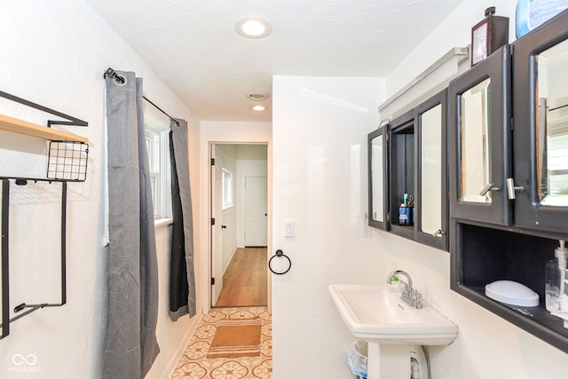 201 N 11th St, Elwood, IN 46036 - bathroom with tile patterned floors, recessed lighting, and a sink