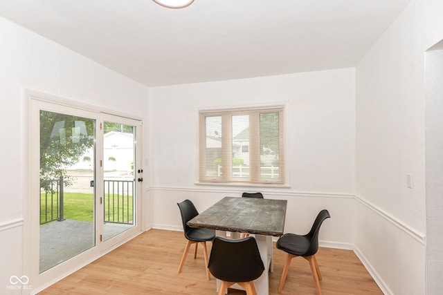 201 N 11th St, Elwood, IN 46036 - dining space featuring light wood finished floors and wainscoting