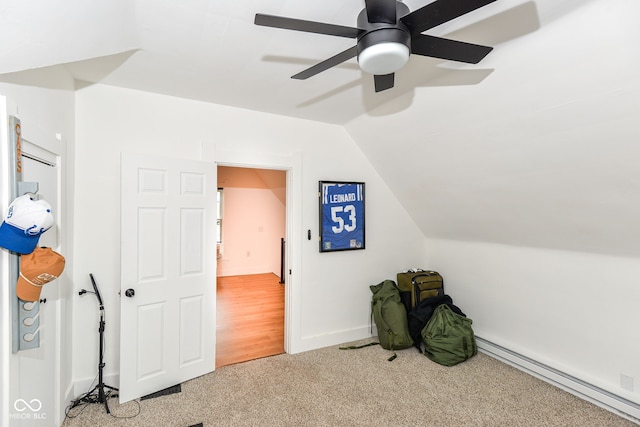 201 N 11th St, Elwood, IN 46036 - unfurnished bedroom with a baseboard heating unit, lofted ceiling, carpet floors, and a ceiling fan