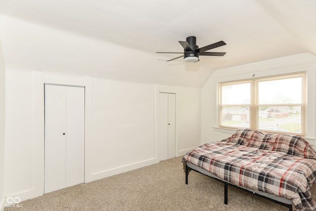201 N 11th St, Elwood, IN 46036 - carpeted bedroom with vaulted ceiling, two closets, and ceiling fan