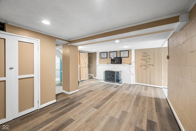 242 W Warford Dr, Princes Lakes, IN 46164 - unfurnished living room with wood finished floors, a fireplace, recessed lighting, baseboards, and ornamental molding