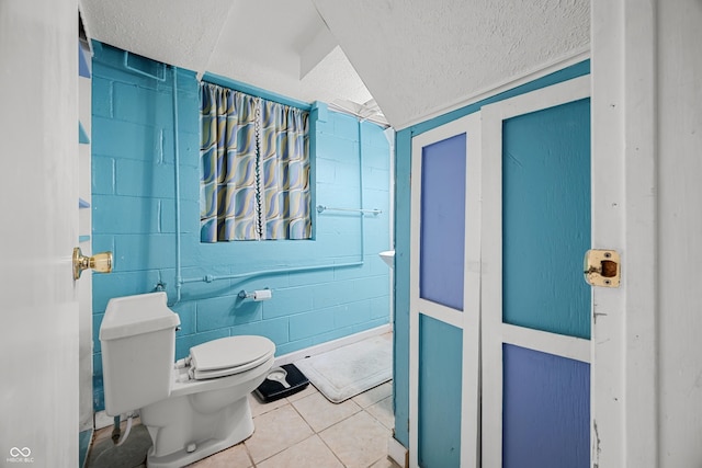 242 W Warford Dr, Princes Lakes, IN 46164 - bathroom with toilet, tile patterned floors, and a textured ceiling