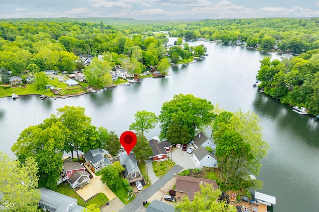 242 W Warford Dr, Princes Lakes, IN 46164 - aerial perspective of suburban area featuring a heavily wooded area and a large body of water