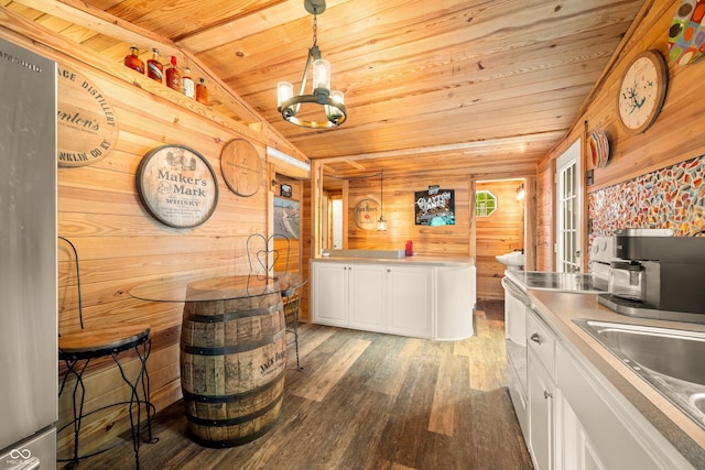 242 W Warford Dr, Princes Lakes, IN 46164 - kitchen featuring wooden ceiling, wood finished floors, wooden walls, white cabinetry, and lofted ceiling