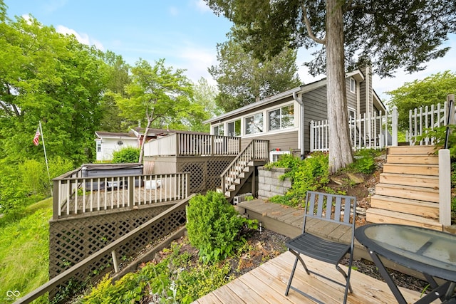 242 W Warford Dr, Princes Lakes, IN 46164 - deck featuring stairway and a hot tub