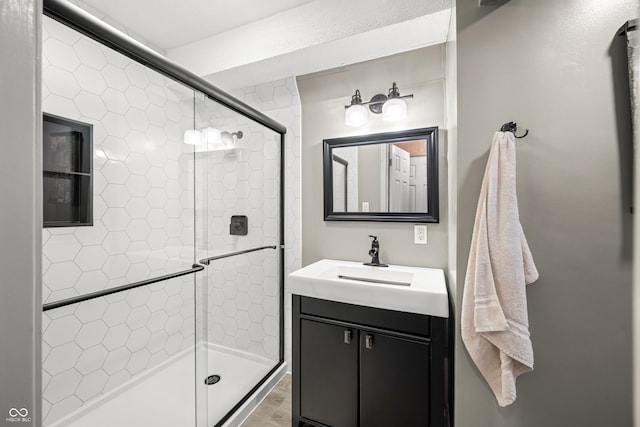 242 W Warford Dr, Princes Lakes, IN 46164 - bathroom with vanity, a shower stall, and wood finished floors
