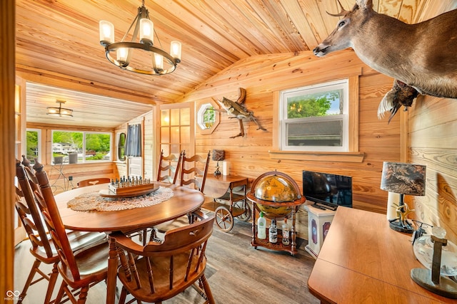 242 W Warford Dr, Princes Lakes, IN 46164 - dining room with a chandelier, wooden walls, wood finished floors, wood ceiling, and vaulted ceiling