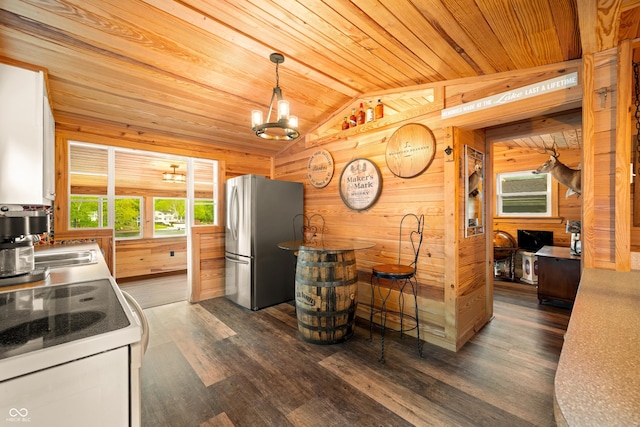 242 W Warford Dr, Princes Lakes, IN 46164 - kitchen with freestanding refrigerator, wood walls, lofted ceiling, white range with electric stovetop, and wood ceiling