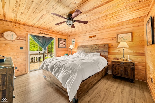 242 W Warford Dr, Princes Lakes, IN 46164 - bedroom with wooden ceiling, wood walls, access to exterior, light wood-style floors, and ceiling fan