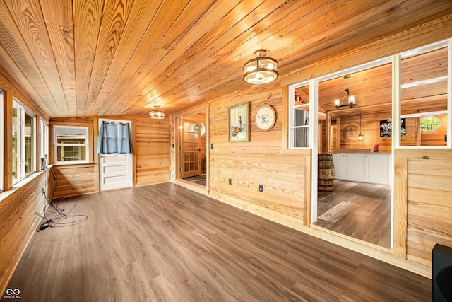 242 W Warford Dr, Princes Lakes, IN 46164 - unfurnished room with wood walls, wood finished floors, a chandelier, and wooden ceiling