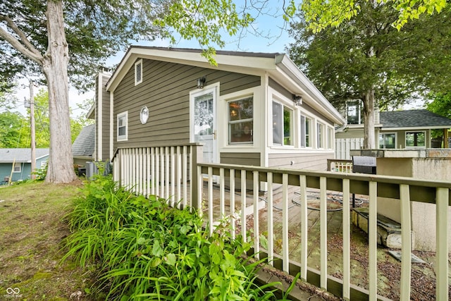 242 W Warford Dr, Princes Lakes, IN 46164 - view of side of property featuring a chimney and a wooden deck