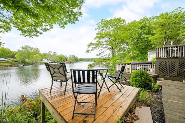242 W Warford Dr, Princes Lakes, IN 46164 - deck featuring a water view and view of scattered trees