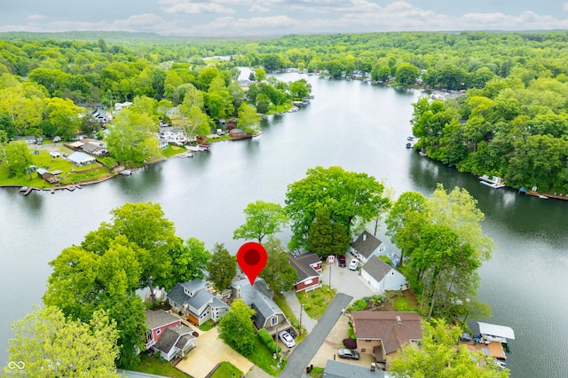 242 W Warford Dr, Princes Lakes, IN 46164 - aerial perspective of suburban area with a heavily wooded area and a nearby body of water