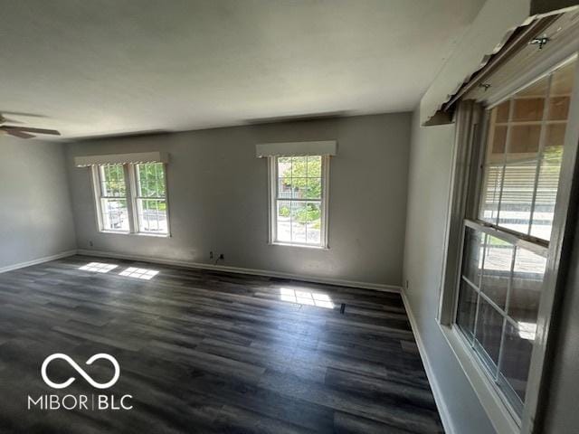 1527 Main St, Beech Grove, IN 46107 - empty room with baseboards, dark wood-style floors, and a ceiling fan