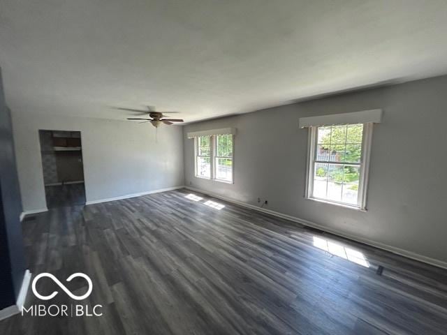 1527 Main St, Beech Grove, IN 46107 - unfurnished living room with a ceiling fan, dark wood-style floors, and baseboards