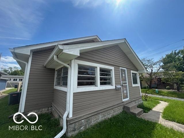 1527 Main St, Beech Grove, IN 46107 - view of home's exterior with cooling unit and entry steps