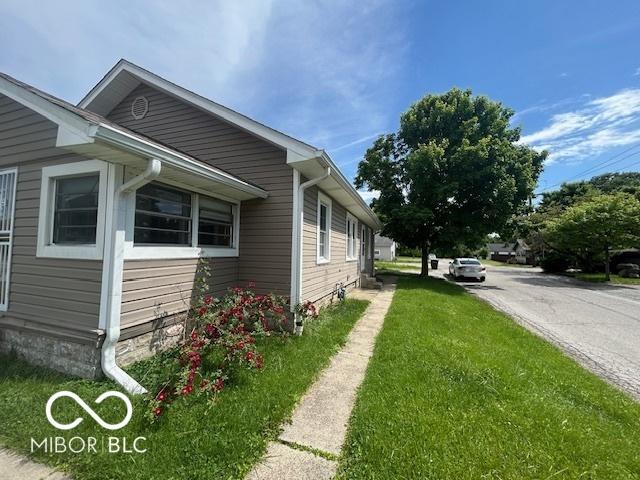1527 Main St, Beech Grove, IN 46107 - view of side of property with a lawn