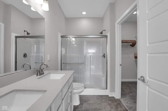 633 Bridgeman Rd, Avon, IN 46123 - full bath with a shower stall, a walk in closet, double vanity, and toilet