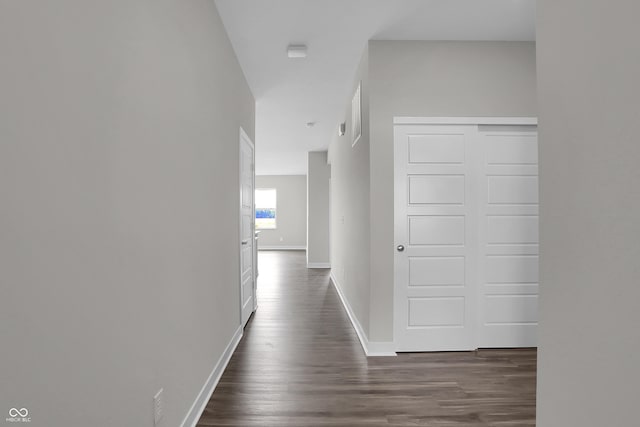 633 Bridgeman Rd, Avon, IN 46123 - corridor with dark wood-style floors and baseboards