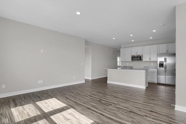 633 Bridgeman Rd, Avon, IN 46123 - kitchen with stainless steel appliances, dark wood-style flooring, recessed lighting, white cabinetry, and baseboards