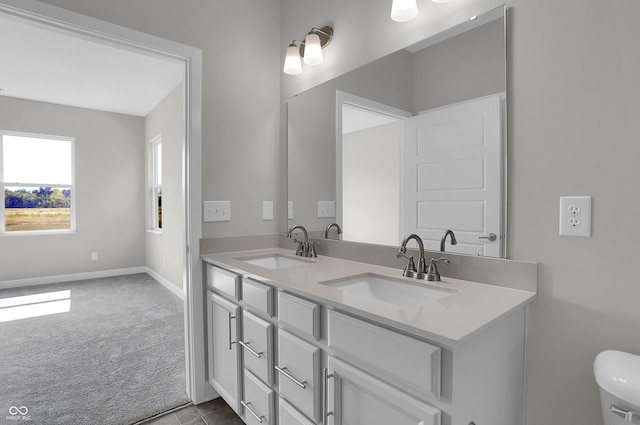 633 Bridgeman Rd, Avon, IN 46123 - full bathroom featuring double vanity, baseboards, and toilet