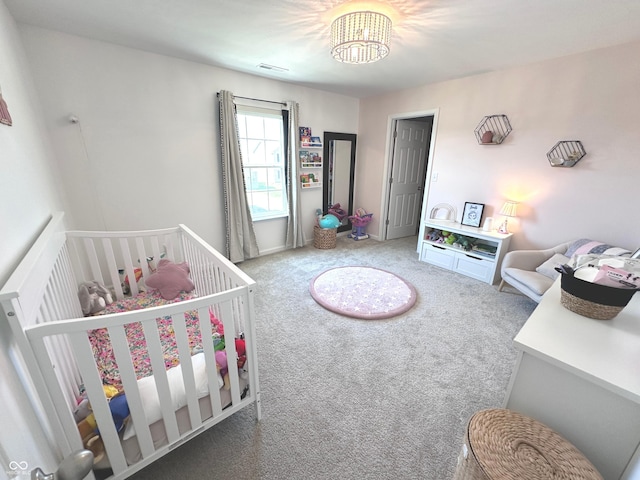 1056 Bent Branch Ln, Greenwood, IN 46143 - carpeted bedroom featuring a chandelier and a crib