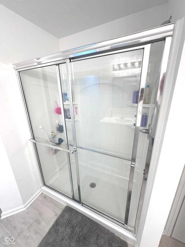 1056 Bent Branch Ln, Greenwood, IN 46143 - full bathroom featuring a shower stall and wood finished floors