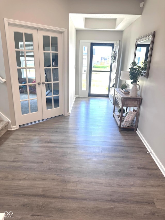 1056 Bent Branch Ln, Greenwood, IN 46143 - doorway to outside featuring french doors, baseboards, dark wood-type flooring, and stairway