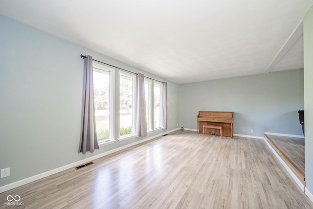 2544 N E Raintree Dr, New Castle, IN 47362 - unfurnished living room featuring wood finished floors and baseboards