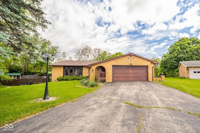 2544 N E Raintree Dr, New Castle, IN 47362 - ranch-style house with brick siding, driveway, and an attached garage