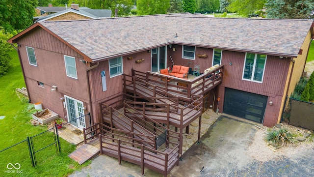 2544 N E Raintree Dr, New Castle, IN 47362 - rustic home featuring a shingled roof, a deck, driveway, and an attached garage