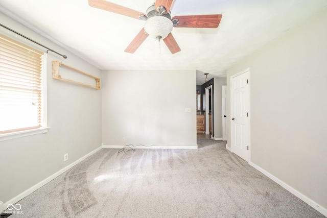 2544 N E Raintree Dr, New Castle, IN 47362 - carpeted spare room featuring baseboards and a ceiling fan