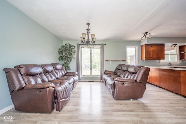 2544 N E Raintree Dr, New Castle, IN 47362 - living room featuring a chandelier and light wood finished floors