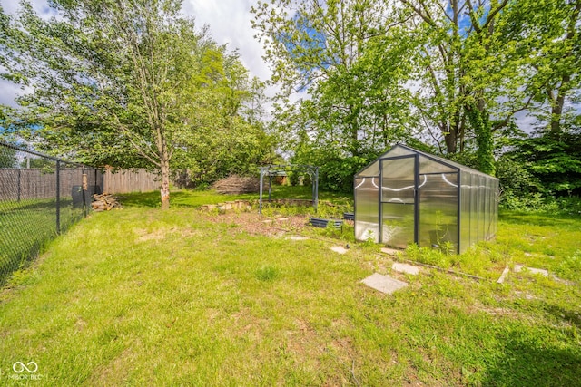 2544 N E Raintree Dr, New Castle, IN 47362 - view of yard featuring a greenhouse and an outdoor structure