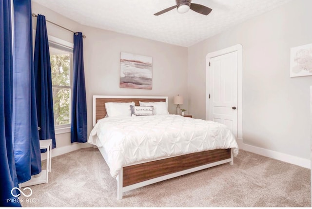 2349 N Capitol Ave, Indianapolis, IN 46208 - carpeted bedroom with baseboards and a ceiling fan