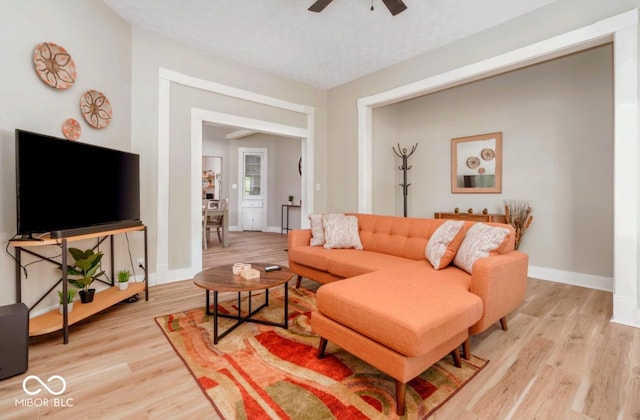 2349 N Capitol Ave, Indianapolis, IN 46208 - living room featuring a ceiling fan, light wood finished floors, and baseboards