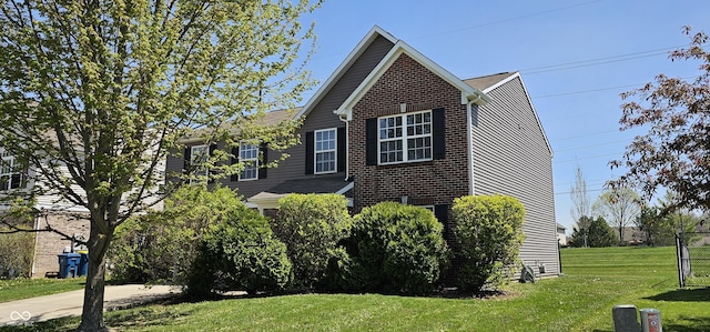 409 Spring Green Pl, Indianapolis, IN 46229 - view of property exterior with brick siding and a yard