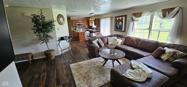 409 Spring Green Pl, Indianapolis, IN 46229 - living room featuring a textured ceiling, dark wood finished floors, and baseboards