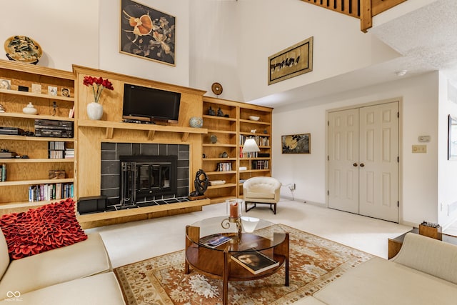 5326 White Marsh Ln, Indianapolis, IN 46226 - living area with a tile fireplace, a high ceiling, and carpet floors