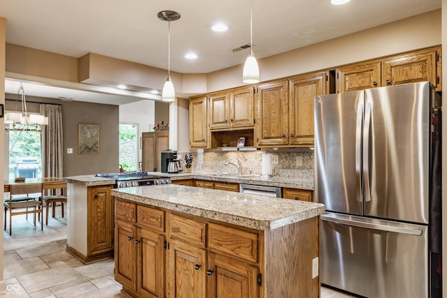 5326 White Marsh Ln, Indianapolis, IN 46226 - kitchen with appliances with stainless steel finishes, a center island, light countertops, a sink, and recessed lighting