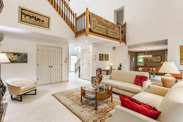 5326 White Marsh Ln, Indianapolis, IN 46226 - living room with a high ceiling, stairs, a chandelier, and carpet