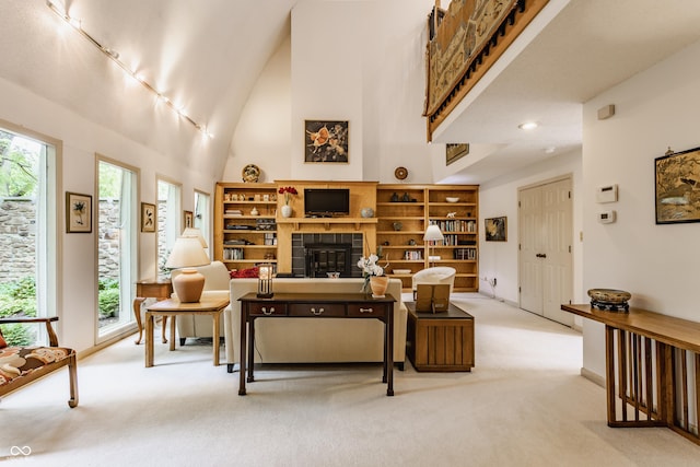 5326 White Marsh Ln, Indianapolis, IN 46226 - living area featuring light colored carpet, a tiled fireplace, and baseboards