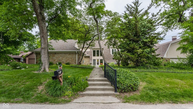 5326 White Marsh Ln, Indianapolis, IN 46226 - mid-century inspired home with a front lawn, brick siding, and roof with shingles