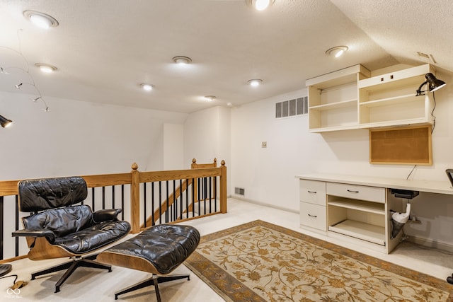 5326 White Marsh Ln, Indianapolis, IN 46226 - living area featuring vaulted ceiling, an upstairs landing, light carpet, a desk, and a textured ceiling