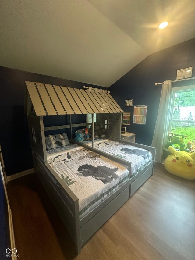 9527 Pepperidge Dr, Indianapolis, IN 46235 - bedroom with wood finished floors and lofted ceiling